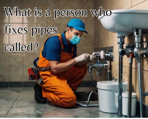 Plumber kneels, working on joint.